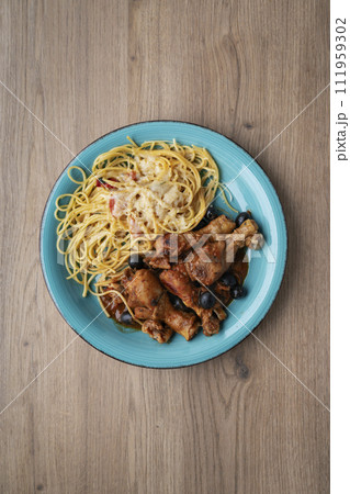 Cacciatore hunter's stew with spaghetti noodles 111959302