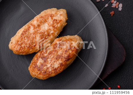Delicious fresh fried minced fish cutlets with spices and herbs Delicious fresh fried minced fish cutlets with spices and herbs 111959456