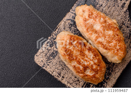 Delicious fresh fried minced fish cutlets with spices and herbs Delicious fresh fried minced fish cutlets with spices and herbs 111959487