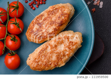 Delicious fresh fried minced fish cutlets with spices and herbs Delicious fresh fried minced fish cutlets with spices and herbs 111959500