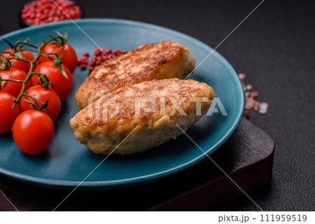 Delicious fresh fried minced fish cutlets with spices and herbs 111959519