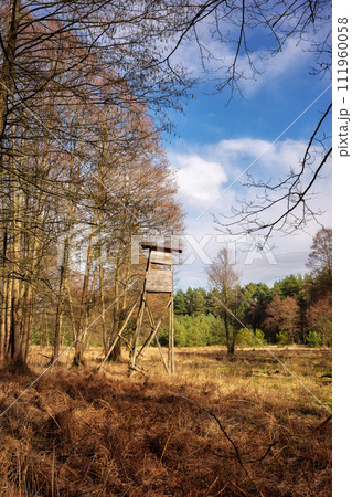 Photo of an elevated deer hunting blind by the woods. 111960058