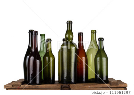 Antique retro green glass bottles on wooden box 111961297