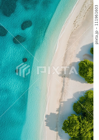 Beautiful tropical island paradise beach with green trees, soft white sand and turquoise water 111961603