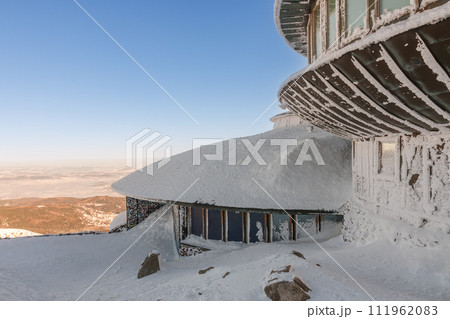 Winter morning , disc shaped meteorological observatory in snezka, mountain on the border between Czech Republic and Poland. Winter morning , disc shaped meteorological observatory in snezka, mountain on the border between Czech Republic and Poland. 111962083