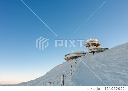 Winter morning, disc shaped meteorological observatory in snezka, mountain on the border between Czech Republic and Poland. 111962092