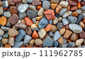 Colorful pebble texture for background, small stones in varying shades, colored beach stones 111962785