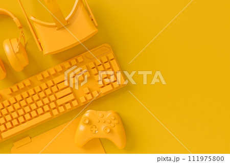 Modern home office setup featuring keyboard, VR glasses and headphones 111975800