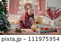 Senior man and his grandchildren together at the kitchen on Christmas holidays 111975954