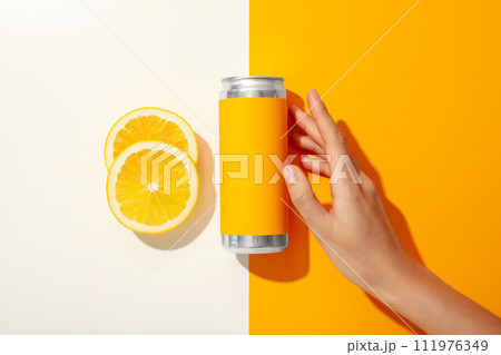 A metal can with fresh lemon halves 111976349