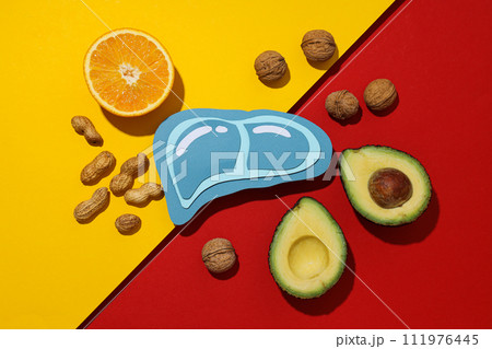 Paper mockup of liver and food on red and yellow background, top view Paper mockup of liver and food on red and yellow background, top view 111976445