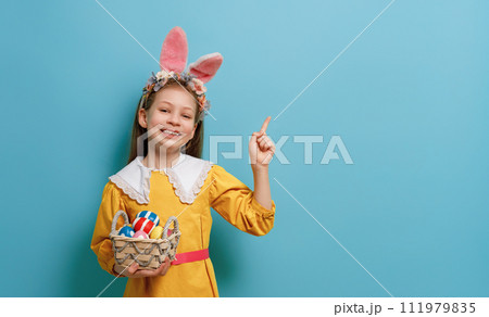 Girl with painted eggs. Girl with painted eggs. 111979835