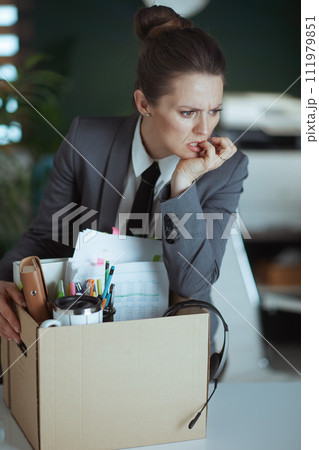 concerned 40 years old woman worker in green office concerned 40 years old woman worker in green office 111979851