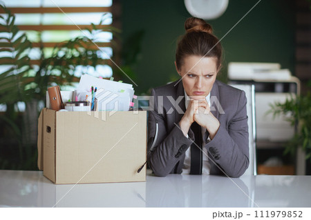 stressed modern woman employee in modern green office stressed modern woman employee in modern green office 111979852