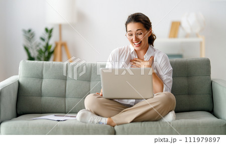 woman working on laptop at home 111979897