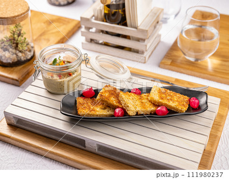 Eggplant spread in a glass jar 111980237