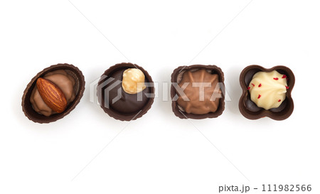 Various chocolate candies isolated on white background. View from above 111982566