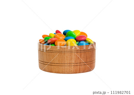 Multicolored candies in a bowl on a colored background. birthday and holiday concept. Top view with copy space 111982701
