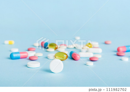 Many different colorful medication and pills perspective view. Set of many pills on colored background 111982702