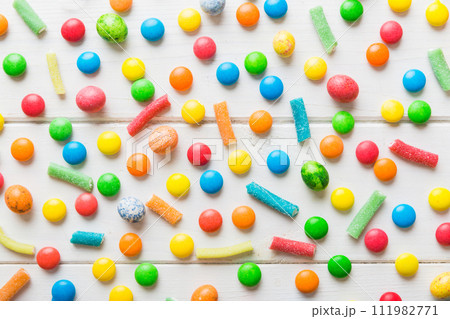 colorful candies as background top view. Seamless pattern with candy. Many sweet candies close-up 111982771