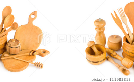 Set of wooden kitchen utensils isolated on white. Collage. Free space for text. Wide photo. 111983812