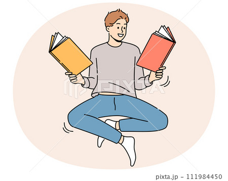 Smiling man floating in air reading books Smiling man floating in air reading books 111984450
