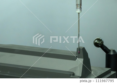 The small touching probe measuring the graphite electrode parts. 111987795
