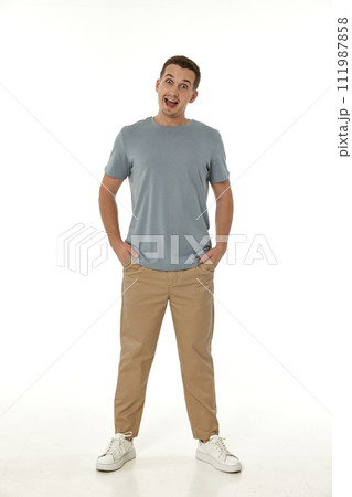 surprised guy looking at camera on white studio background 111987858