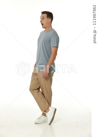 surprised guy looking at camera on white studio background surprised guy looking at camera on white studio background 111987862