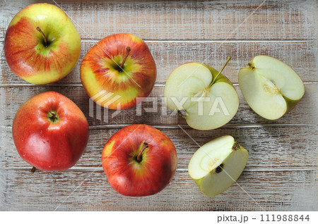 ripe apples in a wooden box 111988844
