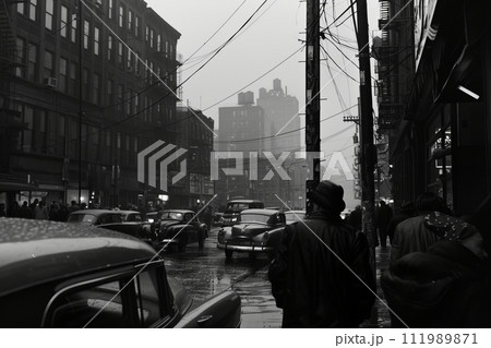 Black and white photo of a street with cars and high-rise buildings 111989871