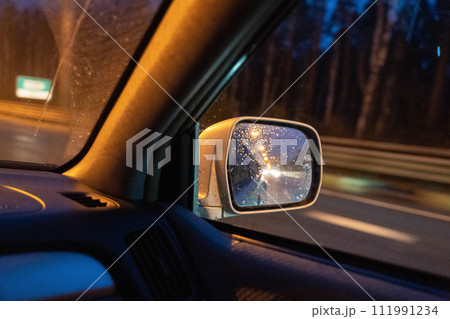 Spectacular night highway view through moving car windows with glowing lights  111991234