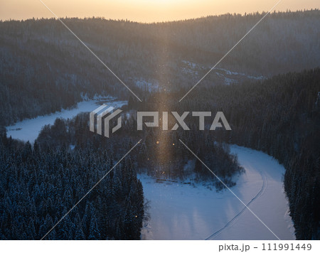 Landscape with winter air, snowy forest and river. 111991449