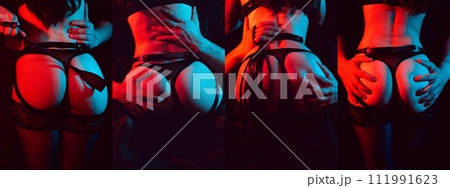 BDSM couple sex. A dominant man with a flogger whip holds in hands the sexy ass of a submissive woman bottom girl with a neon light 111991623