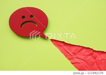 Negative comment and torn paper. Negative comment and torn paper. 111992170