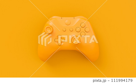 Video game joystick or gamepad in plain monochrome yellow color background 111994179