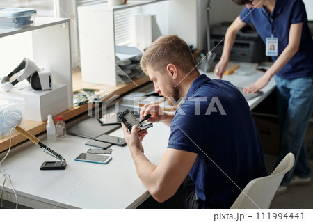 Young worker of technical repair office Young worker of technical repair office 111994441