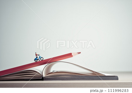 Girl rides on a motorcycle over open diary book. Travel concept Girl rides on a motorcycle over open diary book. Travel concept 111996283