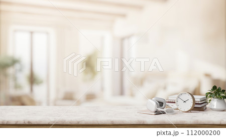 A luxury white marble tabletop with a copy space with a blurred elegant living room. A luxury white marble tabletop with a copy space with a blurred elegant living room. 112000200