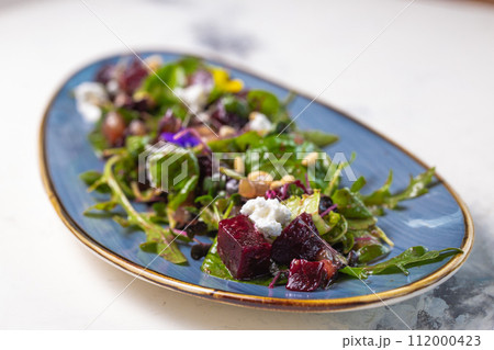 Organic baby greens salad with beets, goat cheese, pistachios, citrus dressing 112000423