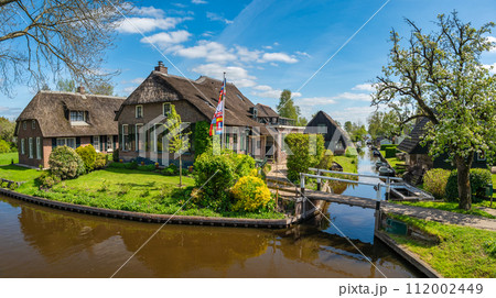 Giethoorn Netherlands, panorama city skyline at canal and traditional house in Giethoorn village Giethoorn Netherlands, panorama city skyline at canal and traditional house in Giethoorn village 112002449