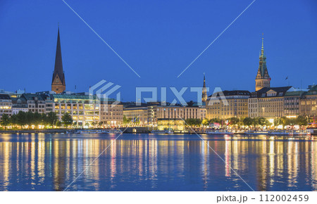 Hamburg Germany, night panorama city skyline at Alster Lake with Fountain 112002459