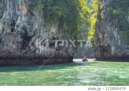 tropical islands view with long tail boat and ocean blue sea water at Koh Hong Island lagoon, Krabi Thailand nature landscape 112002474