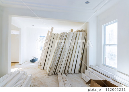 New house is being constructed with interior wooden doors being prepared for installation New house is being constructed with interior wooden doors being prepared for installation 112003231