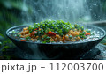 A steaming bowl of fried rice with green peas, carrots, and scallions, captured in a refreshing rain ambiance. 112003700
