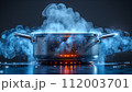 A pot of boiling water emits steam and bubbles, with a dynamic play of light and vapor on a dark background. 112003701