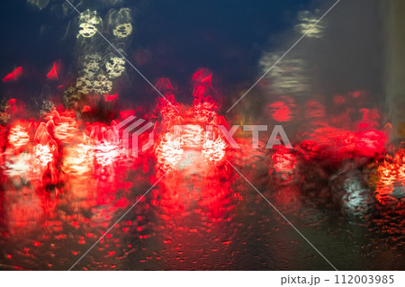 Rainy Night Traffic Lights Bokeh on Windshield 112003985