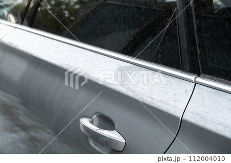 Details of dirty car before washing luxury silver car on touchless car wash. Cleaning the details of car. Cleanliness environment Details of dirty car before washing luxury silver car on touchless car wash. Cleaning the details of car. Cleanliness environment 112004010