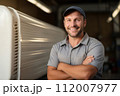 Friendly HVAC male specialist at work. Man worker of air Conditioning systems in industrial setting, optimizing indoor environments. Safe, comfortable, and energy-efficient spaces for living and work 112007977