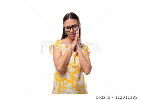 attractive young woman with glasses for vision correction wearing an orange t-shirt attractive young woman with glasses for vision correction wearing an orange t-shirt 112011385